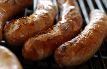 sausages and meat on a grill
