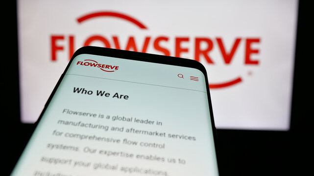 Stuttgart, Germany - 11-13-2024: Mobile phone with website of US machinery company Flowserve Corporation on screen in front of business logo. Focus on top-left of phone display.