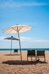 lonely beach chairs on the sunny beach. 