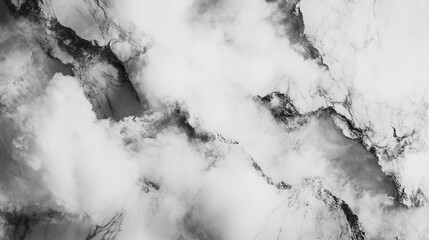 Abstract black and white marble texture with cloud-like formations and natural patterns