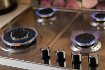 Gas Stove Burner with Blue Flame. close up