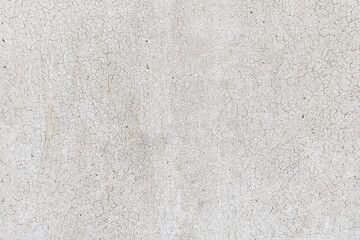 Fototapeta premium abstract background of an old shabby painted white wall close up