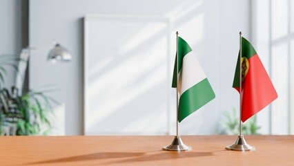 FLAGS OF NIGERIA AND PORTUGAL ON TABLE