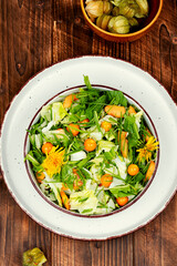 Salad with physalis and field grass
