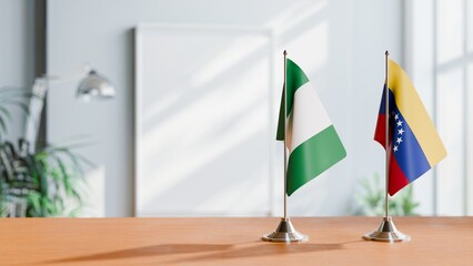 FLAGS OF NIGERIA AND VENEZUELA ON TABLE