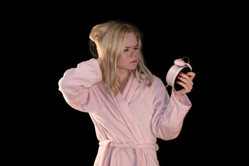 Sleepy Girl Checking Alarm Clock in Pink Bathrobe
