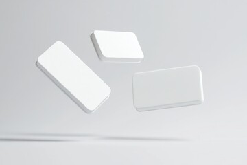 Three white boxes are floating in the air. The boxes are white and rectangular in shape. The boxes are not attached to anything and are floating freely. Empty space for logo or text, mockup