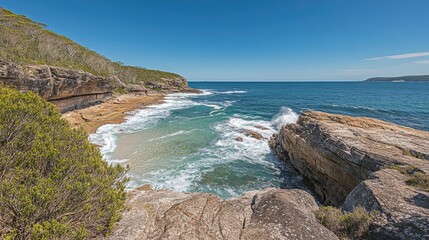 Serene Coastal View with Waves Crashing on Rocky Shoreline