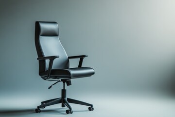 A black office chair sits in front of a gray wall. The chair is empty and has no one sitting in it. Empty space for logo or text, mockup