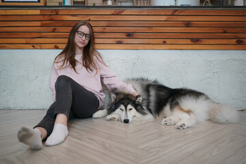 Woman with dogs in a cozy home