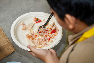 People eating spicy Vermicelli salad with minced pork in plate