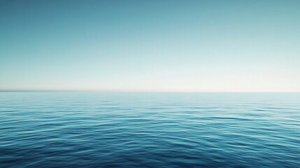 Obraz premium Calming Blue Gradient Sky Over Tranquil Water Surface