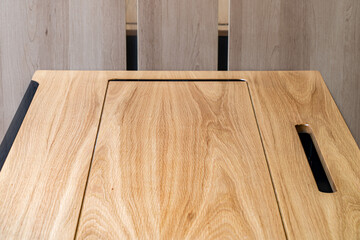 Mobile phone with wireless charger on table. Modern workplace accessory