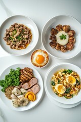 A colorful array of gourmet dishes featuring meats, vegetables, and eggs on a white table.