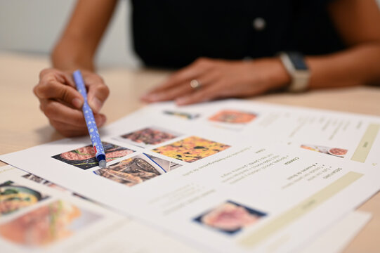 Nutritionist creating personalized meal plan for client in clinic
