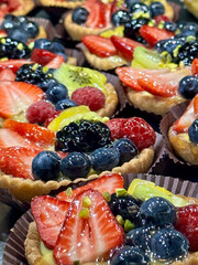 Delicious Mixed Berry Tarts with Colorful Fresh Fruits and Glossy Glaze
