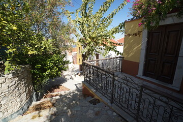 Obraz premium picturesque facades of Symi island streets