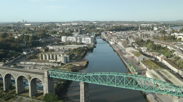 The drogheda viaduct crossing the river boyne surrounded by urban and industrial scenery , aerial view