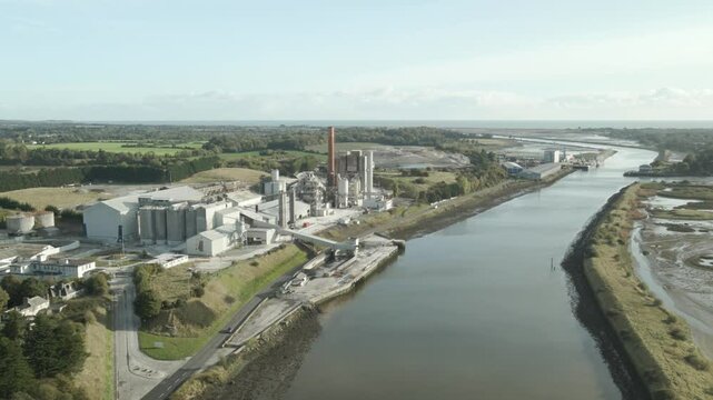 Drogheda with the boyne river and premier periclase factory on a clear day , aerial view