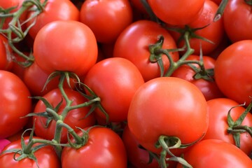Close up of fresh farmers market vine tomatoes background