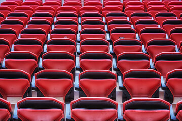 Naklejka premium Perspective of many empty red stadium seats