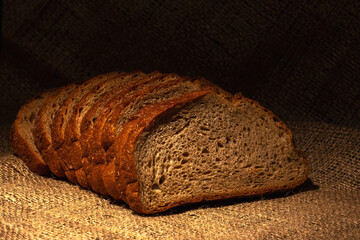 Crown of thorns and rosary beads on brown texture background with space for text
