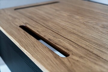 Mobile phone with wireless charger on table. Modern workplace accessory