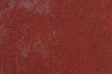 Close up of red rubber floor. Outdoor decoration. Sports running trail