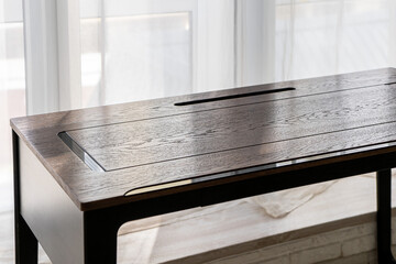 Empty rough wooden table top in the dark room