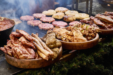 Cutlets and meat on barbecue