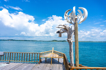 a floating house in the middle of the sea that provides various water sports rides such as snorkeling, diving, and canoeing, and there is also a BBQ for guests who want to