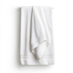 A spa towel with an embroidered border draped neatly on a plain white background highlighting elegance
