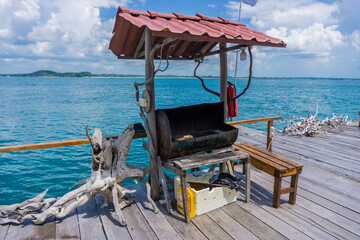 a floating house in the middle of the sea that provides various water sports rides such as snorkeling, diving, and canoeing, and there is also a BBQ for guests who want to