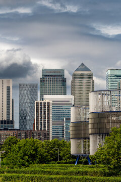 A panoramic view of a captivating city skyline adorned by iconic buildings rising above lush greenery, showcasing the beauty of urban architecture against nature's backdrop in London UK