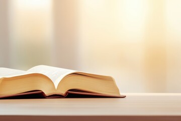 Open Book on Wooden Table with Soft Warm Lighting Creating a Cozy Ambiance