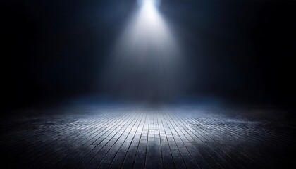 Obraz premium A single spotlight illuminates a dark, empty room or stage.