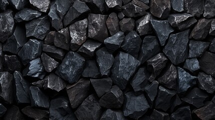 A close up of a pile of rocks with a dark color
