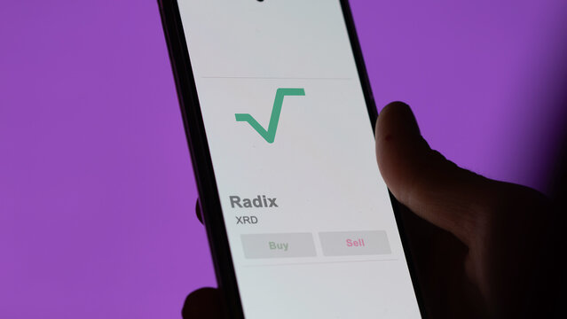 Close up on logo of XRD Radix on the screen of an exchange. XRD Radix price stocks, $XRD on a device.