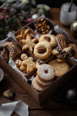 Fototapeta premium cookies de Noël fait maison, boite cookie et chocolats, cadeau pâtisseries, mendiant chocolat sablés
