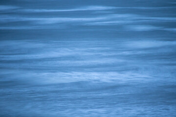 Fototapeta premium Long exposure of blue sea waves 