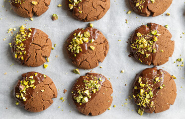 Chocolate Cookies Covered with Chocolate and Sprinkled with Chopped Pistachios – Perfect for Christmas 