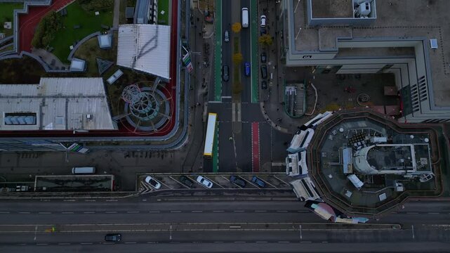 Cityscape of berlin featuring schlossstrasse in Steglitz, a construction crane, buildings, trees, and a cloudy sky. Magic aerial view flight tilt up drone