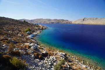 Obraz premium turquoise clear water on Symi island , paradisiac destination