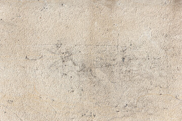 Wall background. Stone beige texture with copy space.