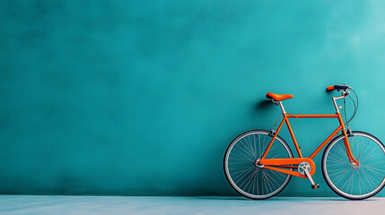 Fototapeta premium An orange bicycle stands against a minimalist teal wall, striking a balance between simplicity and boldness, suggesting a peaceful urban lifestyle and modernity.