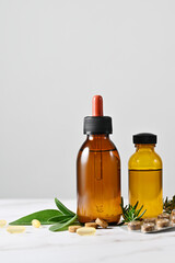 Bottles with herbal syrup or oil with organic pills