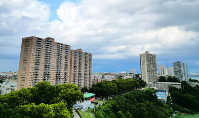 tall apartment buildings with balconies overlooking manhattan new york (west weehawken jersey city hoboken) ny nj housing real estate residential tower living rent skyline © Yuriy T