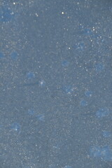 This window glass is frozen in sunny early winter day. 