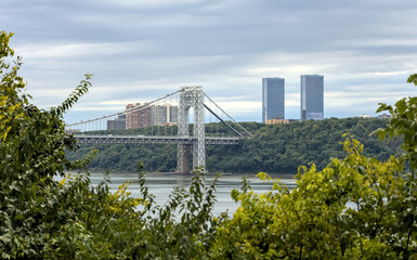 view of george washington bridge (gwb) cloudy day with hudson river and fort lee new jersey towers...