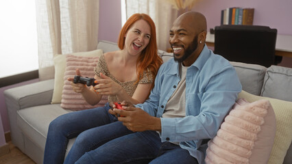 Couple playing video games in a cozy living room, demonstrating their love and joy in an...